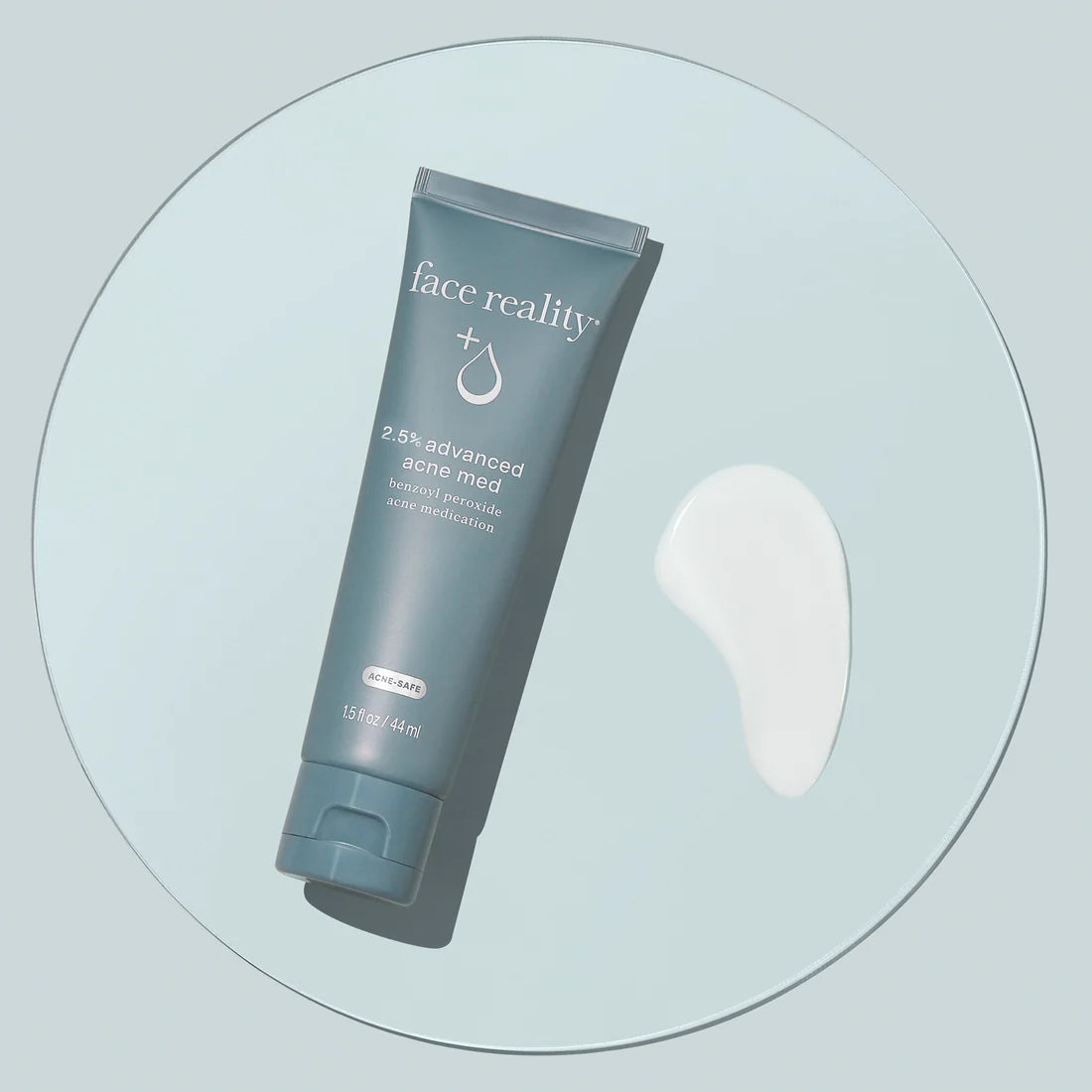 Tube of 'face reality' cream on a light gray background