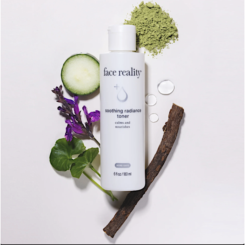 Skincare bottle labeled 'face reality soothing radiance toner' with natural elements on a light background