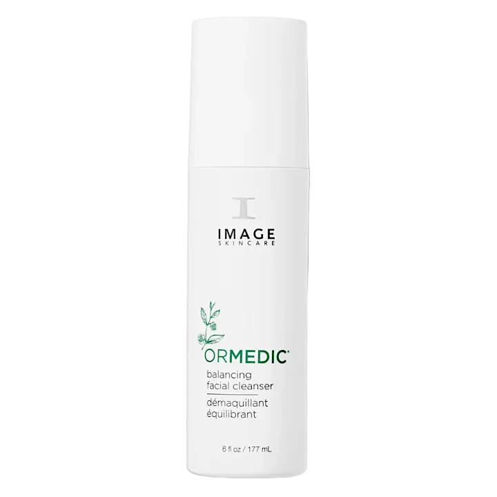 A pump bottle of IMAGE Skincare ORMEDIC Balancing Facial Cleanser with a white and green label, indicating it is a facial cleanser for sensitive skin.