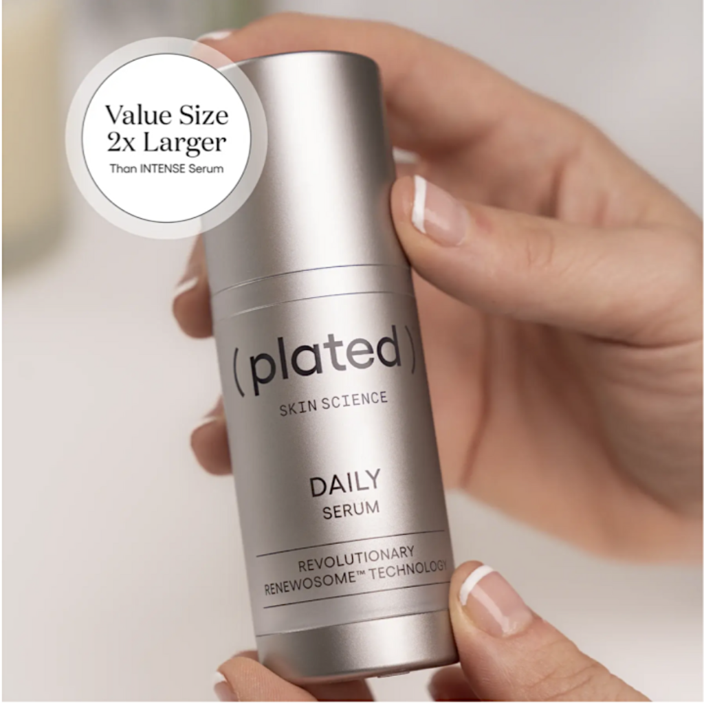 Hand holding a 'plated' Daily Serum with a value size label.