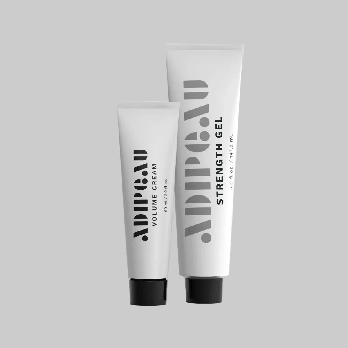 Two tubes of Adipau hair care products on a light gray background