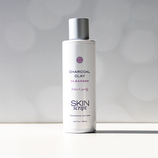 Skincare bottle labeled 'Charcoal Clay Cleanser' by 'Skin Script' on a white background