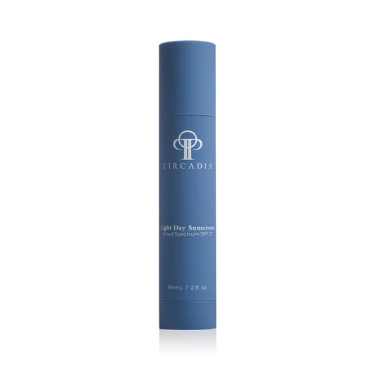 Blue bottle of Light Day SPF 37 sunscreen with Circadia logo on a white background