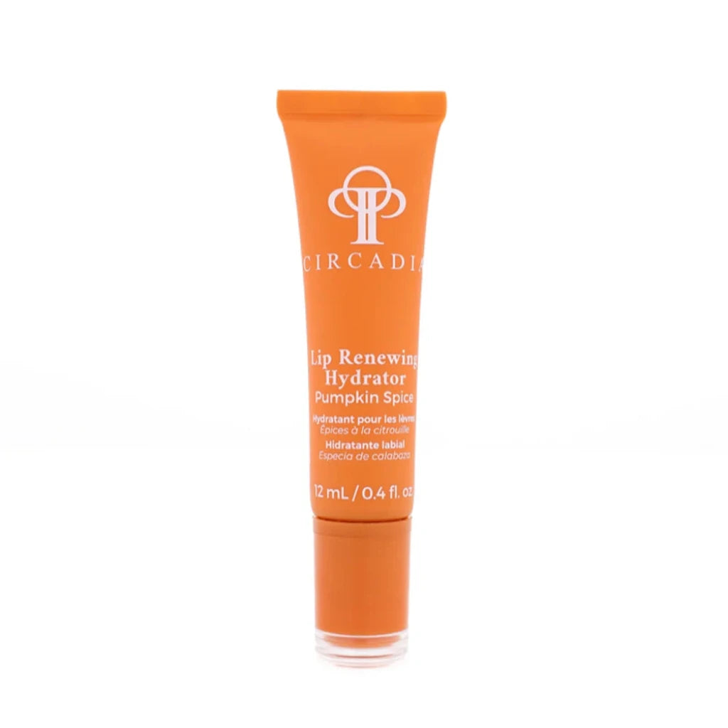 A tube of Circadia Lip Renewing Hydrator Pumpkin Spice lip balm, featuring an orange squeeze tube with white text and a clear cap, set against a plain white background.