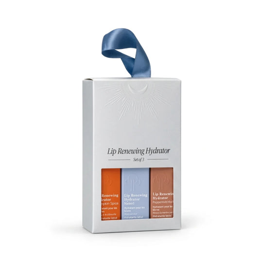 Circadia Lip Renew Hydraor gift box on a white background. Box has a blue ribbon handle and a clear window showing three lip care strips in orange, blue, and brown packaging.