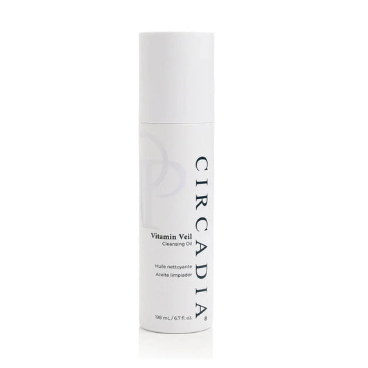 A white cylindrical bottle of Circadia Vitamin Veil Cleansing Oil on a clean white background with a subtle reflection.
