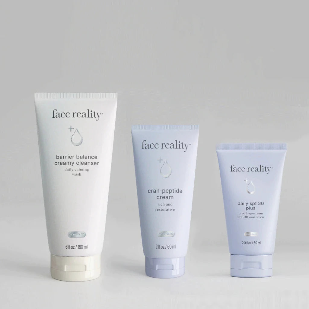 Three 'face reality' skincare products on a light gray background