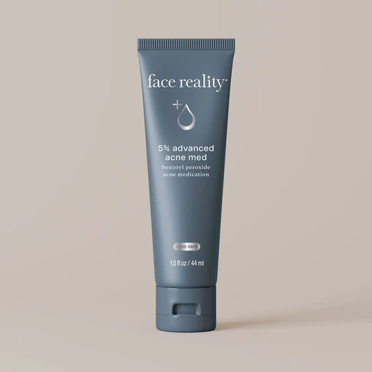 Blue tube of 'face reality' sulfur spot treatment on a beige background