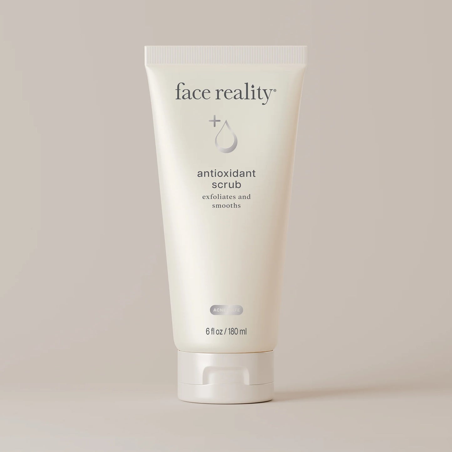 Tube of 'face reality' antioxidant scrub on a light background