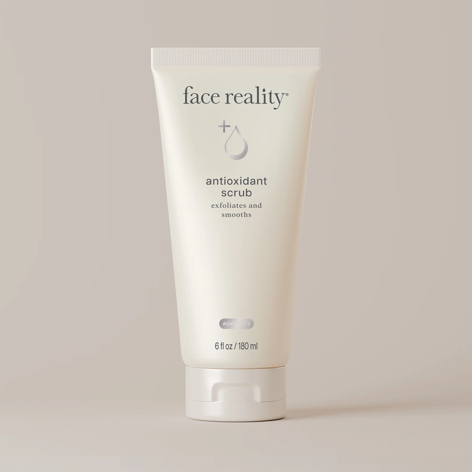 Tube of 'face reality' antioxidant scrub on a light background
