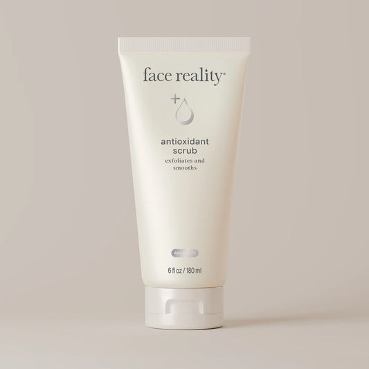 Tube of 'face reality' antioxidant scrub on a light background