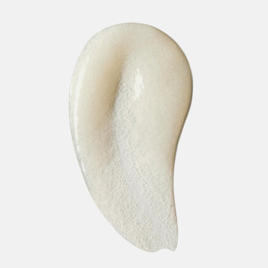 Face Reality Antioxidant Scrub Close-up of a smooth, beige-colored cream on a white background