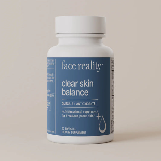 Supplement bottle labeled 'face reality clear skin balance' on a beige background