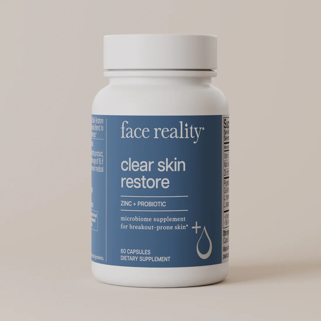 Supplement bottle labeled 'face reality clear skin restore' on a beige background