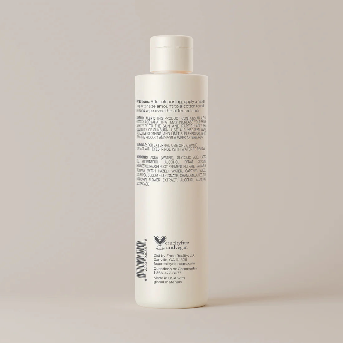 White bottle with label on a light gray background