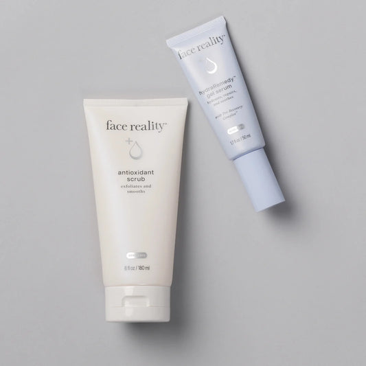 Two skincare products from 'face reality' on a gray background