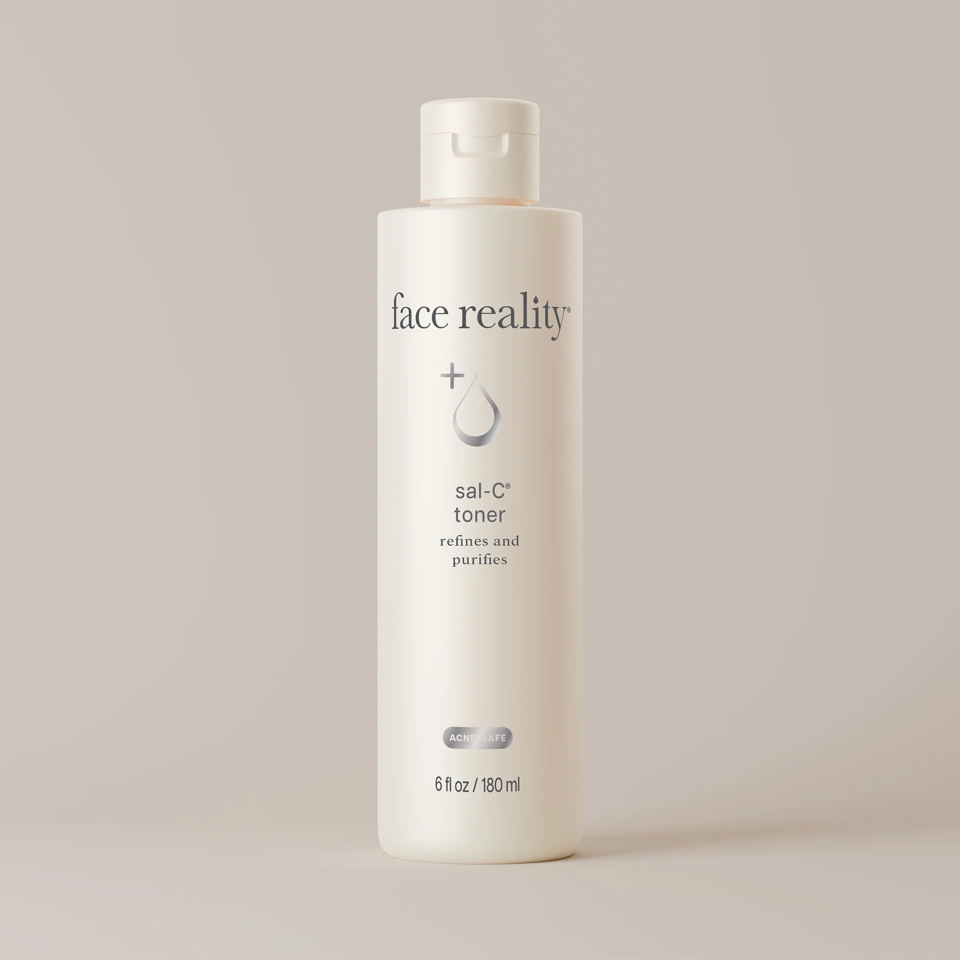 White bottle of 'face reality' sai-C toner on a light beige background