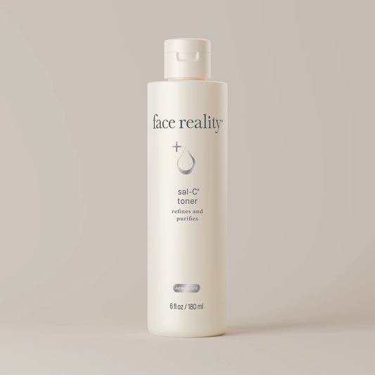White bottle of 'face reality' sai-C toner on a light beige background