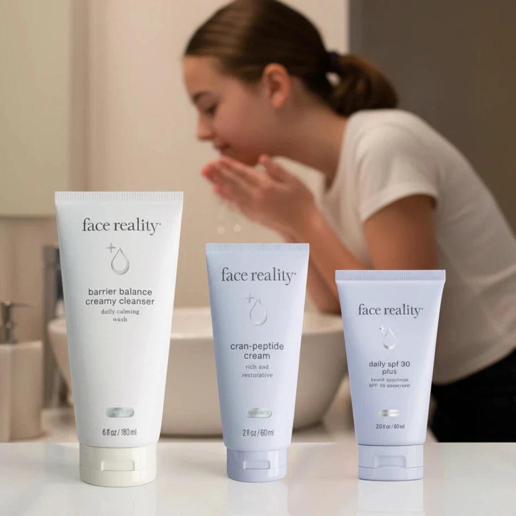 Three 'face reality' skincare products on a light gray background
