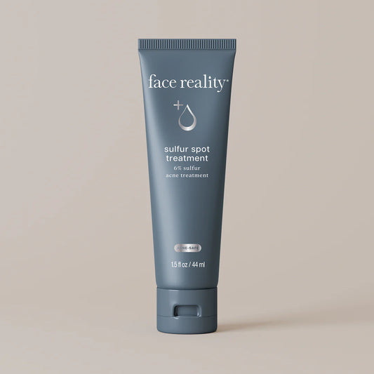 Blue tube of 'face reality' sulfur spot treatment on a beige background