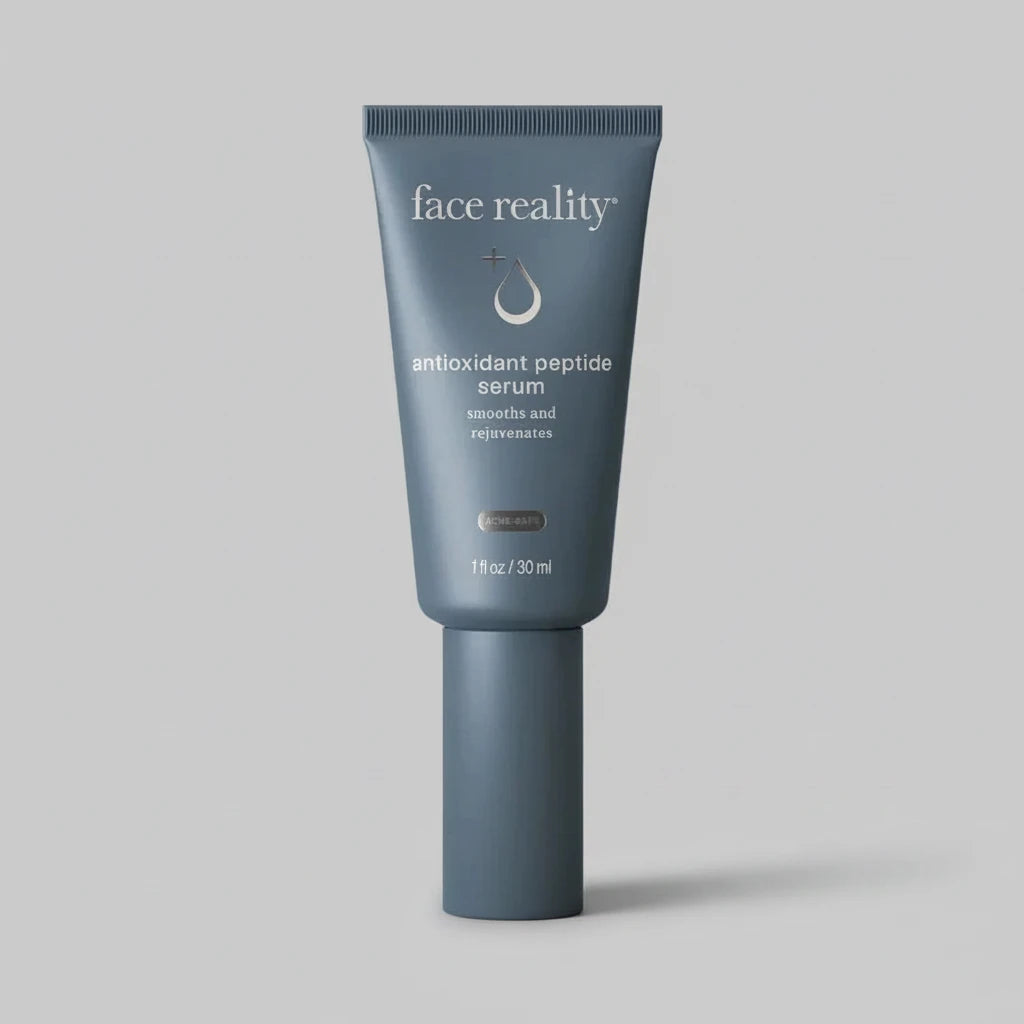 Blue tube of 'face reality' antioxidant peptide serum on a beige background