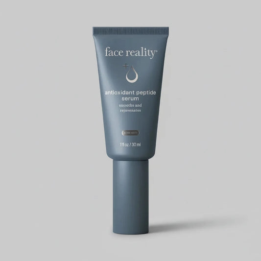Blue tube of 'face reality' antioxidant peptide serum on a beige background