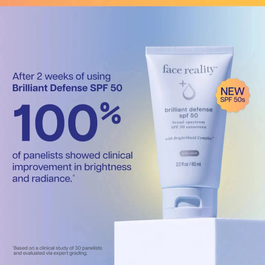 Tube of 'face reality' Brilliant Defense SPF 50 sunscreen with promotional text on a gradient background