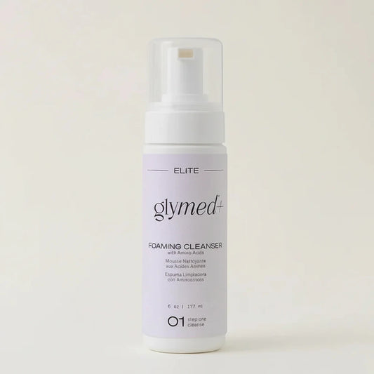 Glymed Plus Foaming Cleanser bottle on a light beige background