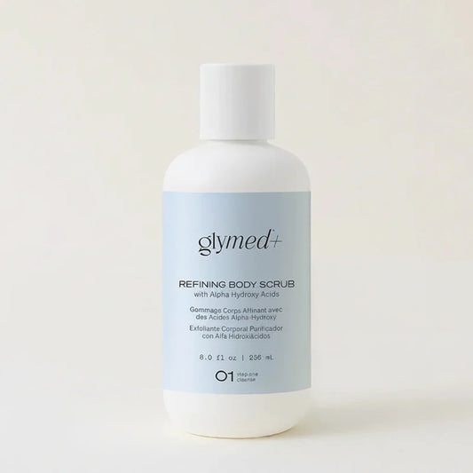 Glymed Plus refining body scrub bottle on a light background