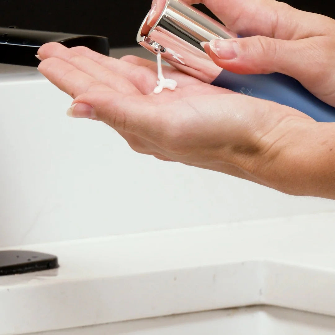 Hand using Glymed Plus Ultra Hydro Gel pump dispenser to their palm.