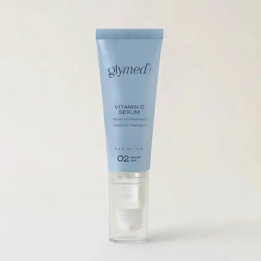 Glymed Plus Vitamin C Serum tube on a light gray background