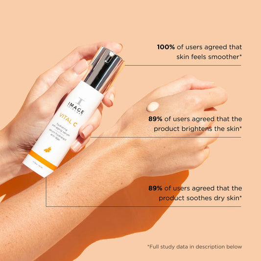 Hand holding a skincare product with text on skin benefits on a beige background
