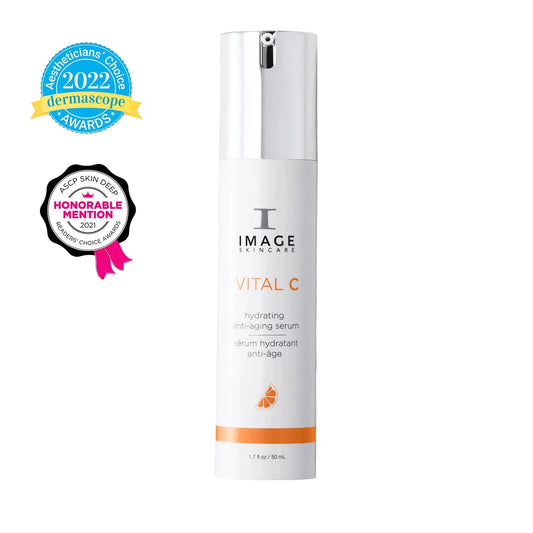 Skincare serum bottle labeled 'Vital C' with awards on a white background