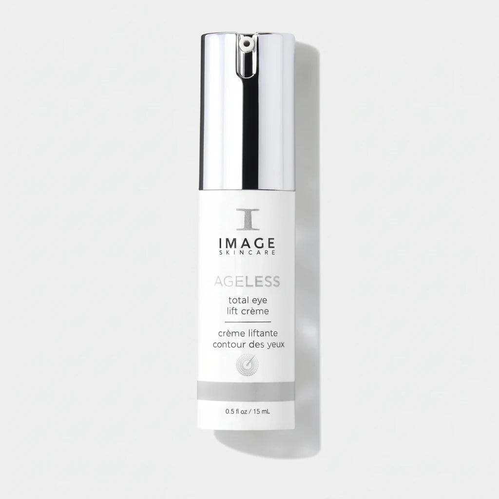 Image Skincare Ageless Total Eye Lift Crème in a white bottle with a reflective silver cap, shown on a clean white background with a soft shadow.