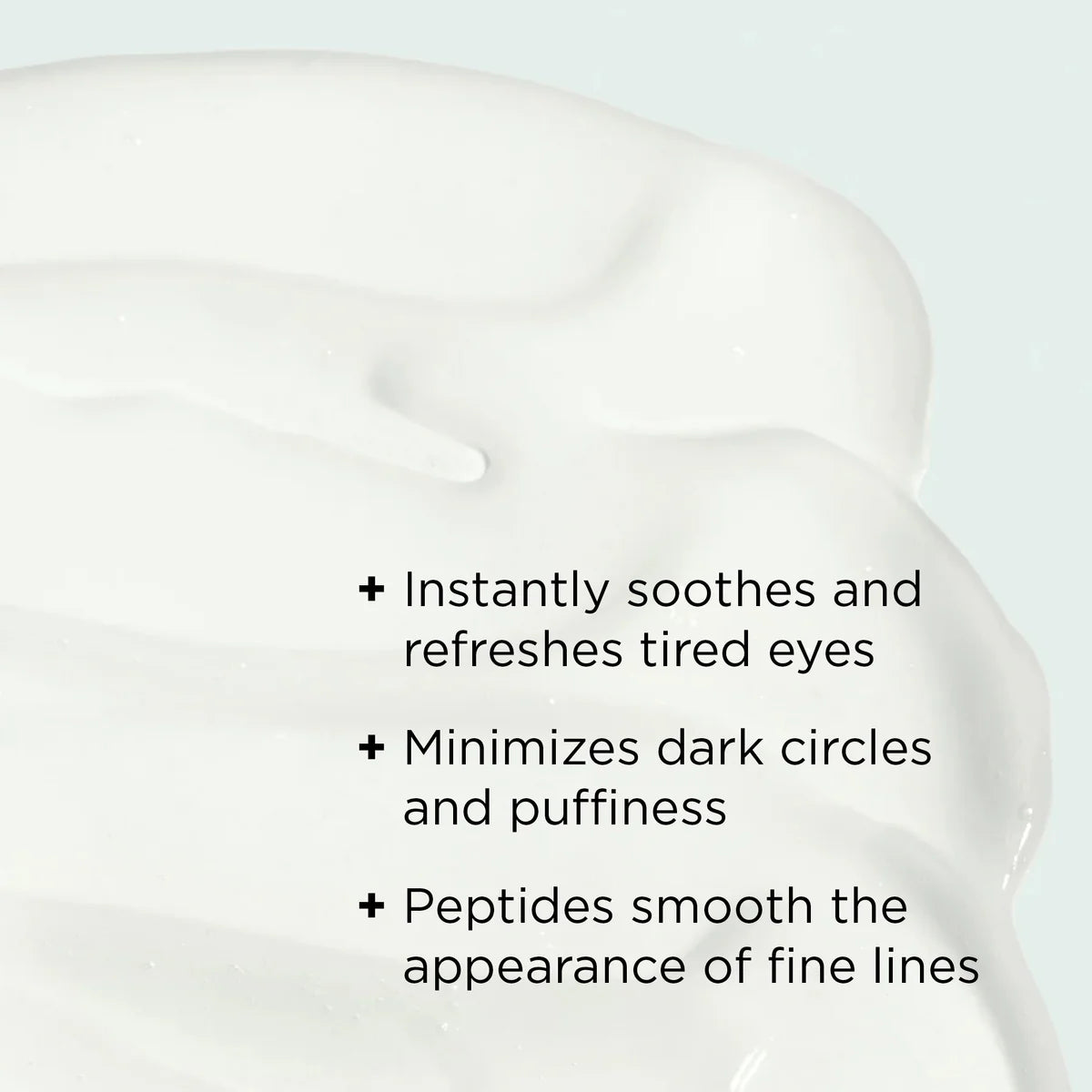 Eye cream smear with text on a light gray background