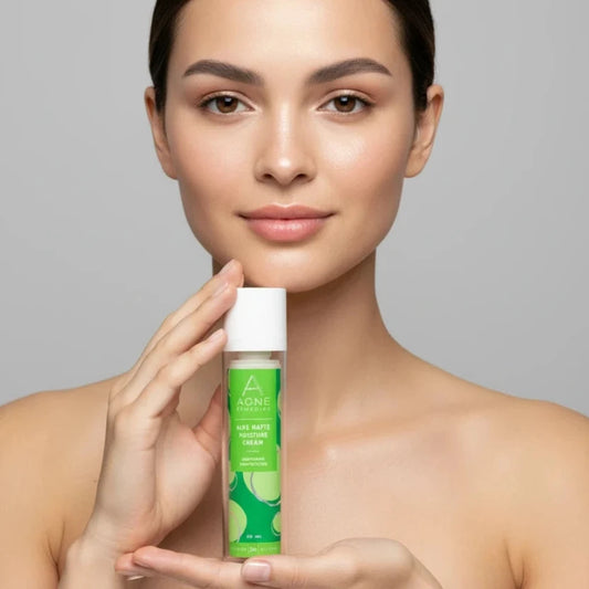 Woman holding a green skincare bottle against a gray background