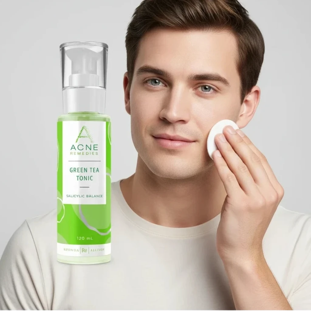 Man applying a facial product with Rhonda Allison Green Tea Tonic in the foreground