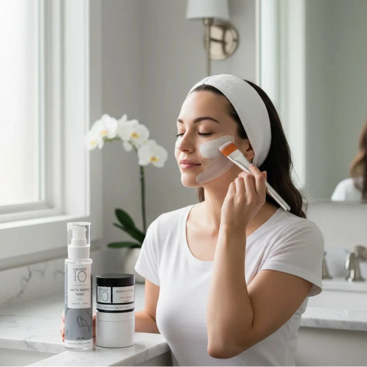 Rhonda Allison Pro Youth 10 skincare set with Lactic Renew Tonic, Instant Lift Mask, and applicator brush on a light gray background.