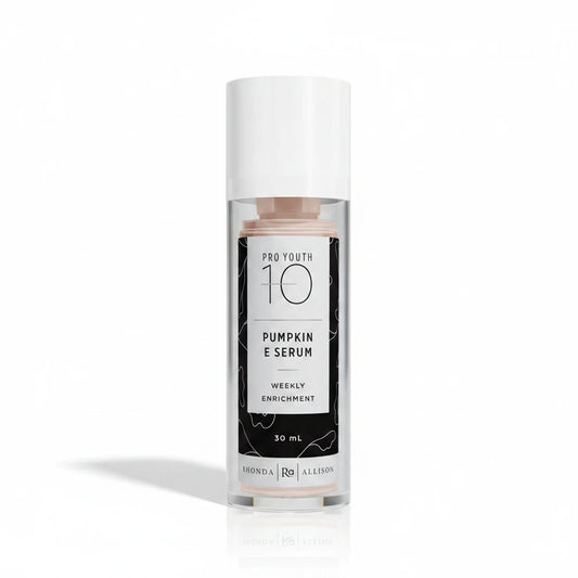 Bottle of Pro Youth 10 Pumpkin E Serum with a white cap on a white background