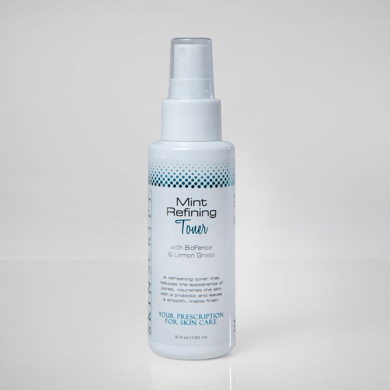 Skin Script Bottle of Mint Refining Toner on a light gray backgrounding