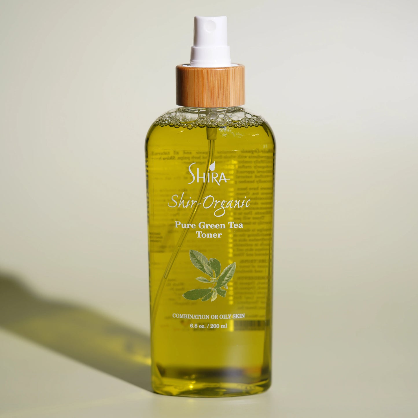 Shira Shir-Organic Pure Green Tea Toner bottle on a beige background