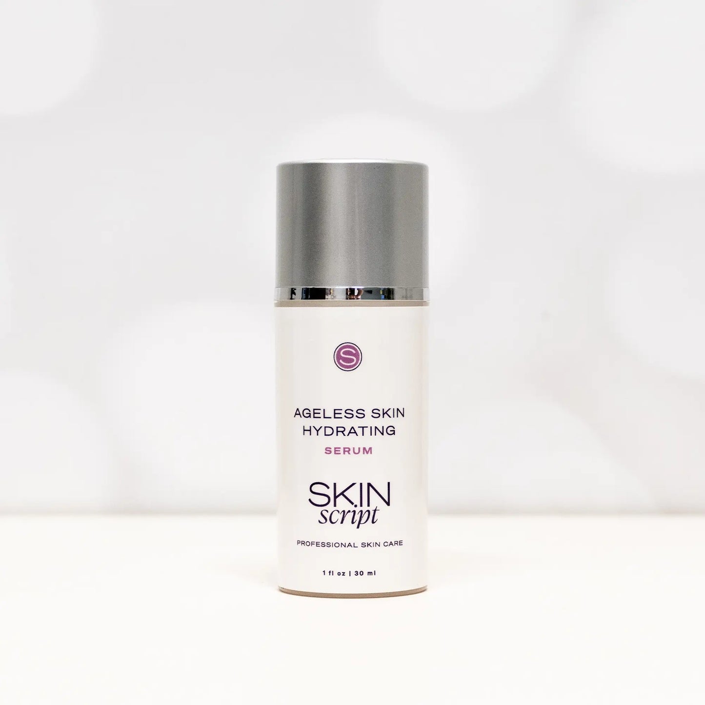 Cylinder bottle of Skin Script Ageless Skin Hydrating Serum 1oz on a light grey background