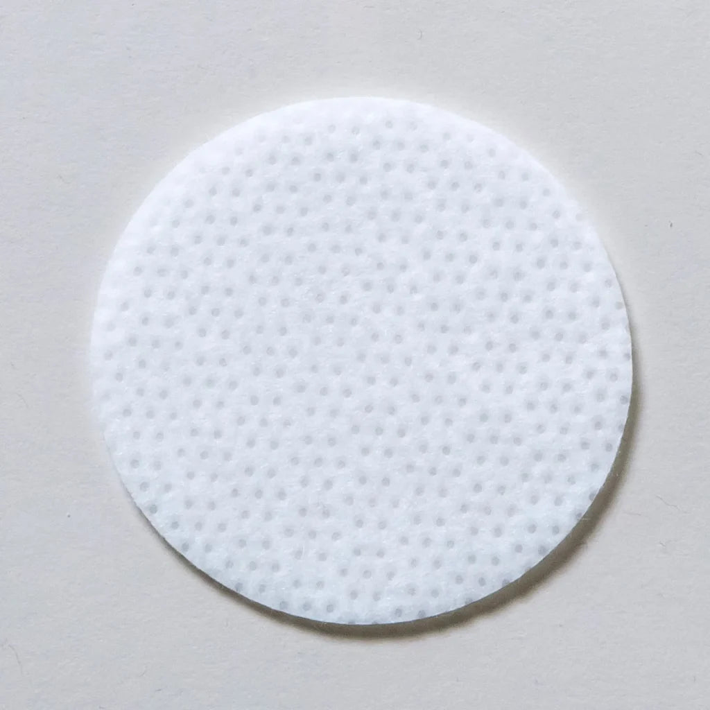Skin Script Clarifying round Toner Pad on a grey background