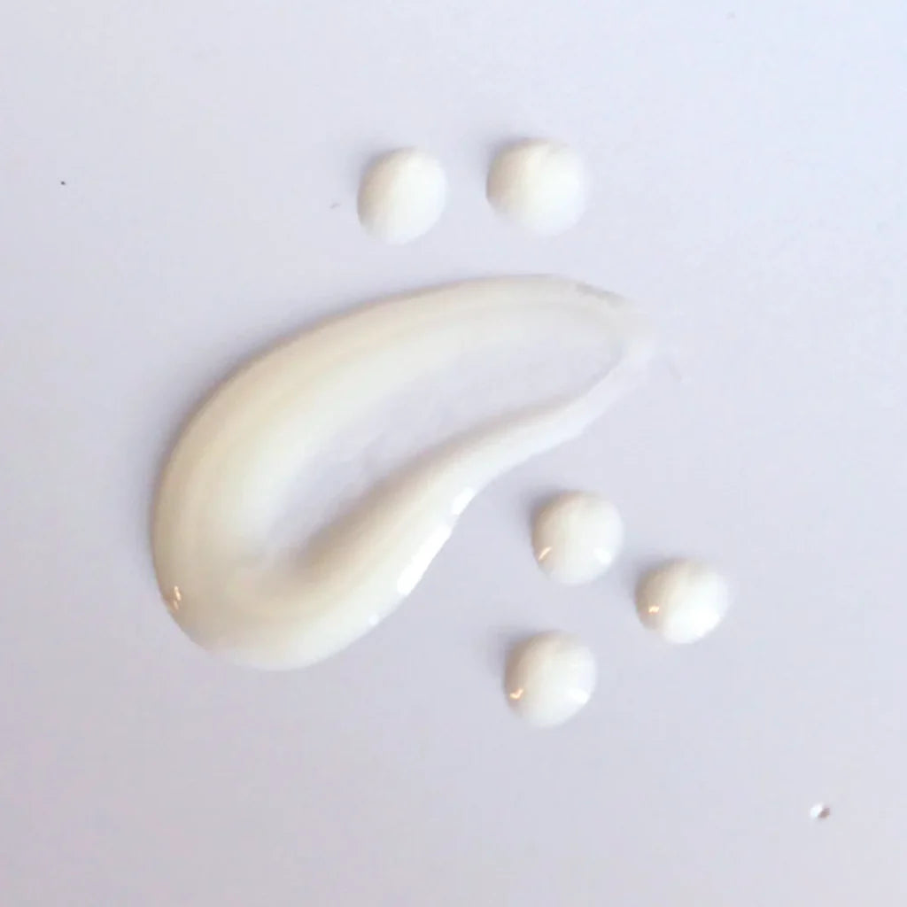 Skin Script Mandelic Brightening Serum smear on a light grey background