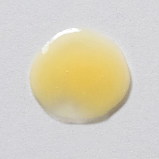 Skin Script Peptide Eye Serum pale yellow Smear on a grey background 