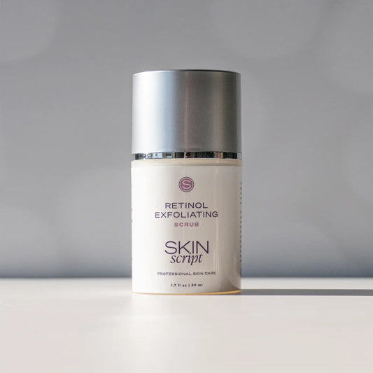 Skincare product labeled 'Retinol Exfoliating Scrub' by 'Skin Script' on a gray background