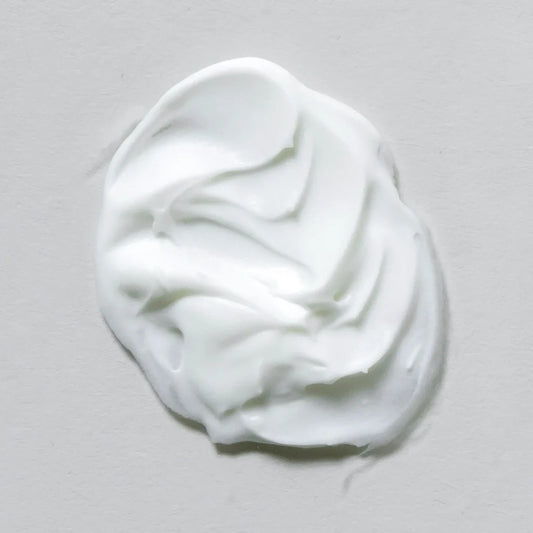 Smear of Skin Script Sheer Protection SPF 30 on grey background