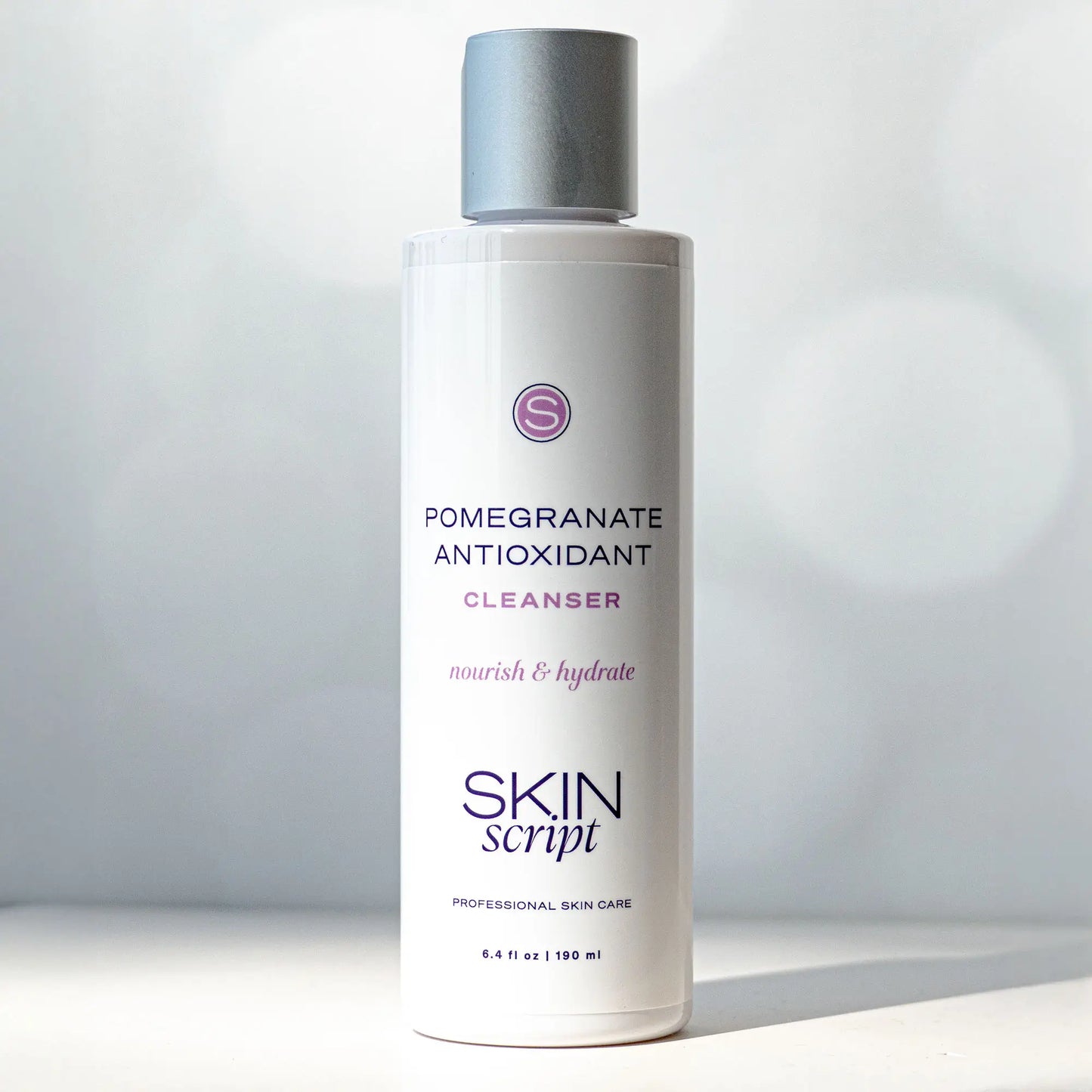 Skincare cleanser bottle with 'Skin Script' branding on a light gray background