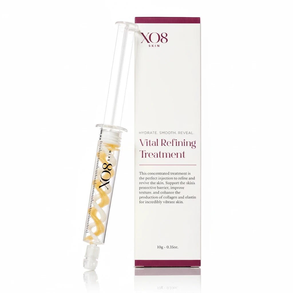 XO8 Skin Vital Refining Treatment shown as a clear syringe with yellow serum droplets next to its white and burgundy packaging box on a white background.