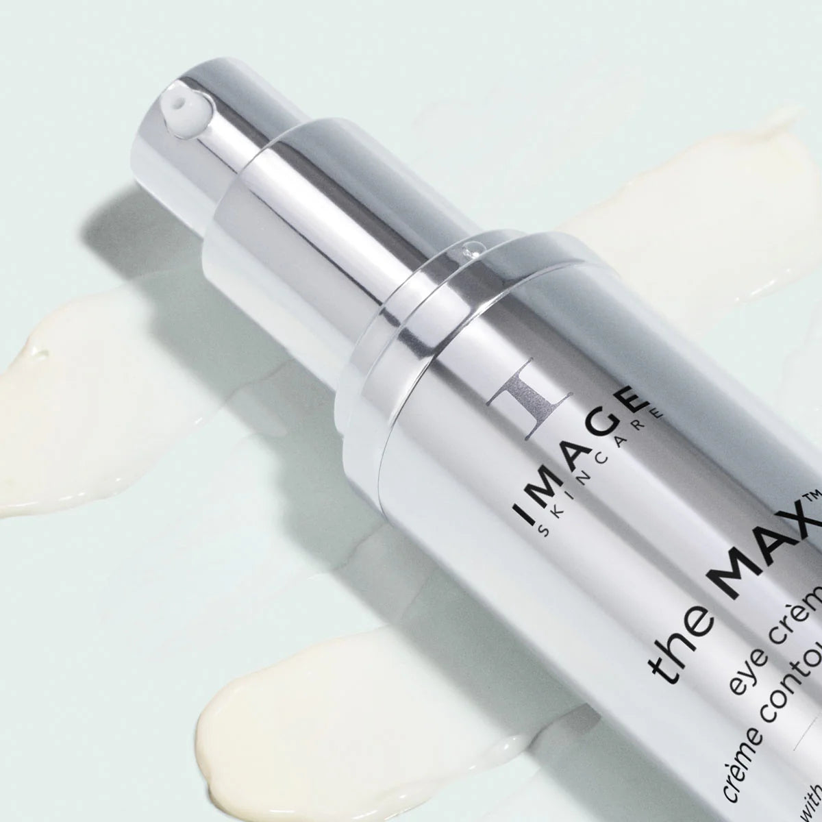 Skincare bottle labeled 'the MAX Eye Creme' by IMAGE Skincare on a light background